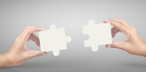 Hand of connecting jigsaw puzzle