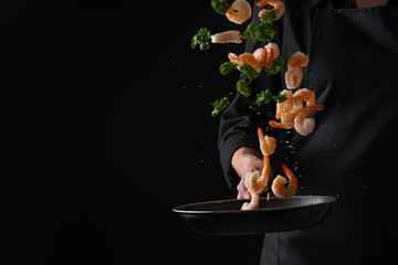 Professional chef prepares shrimps with greens. Cooking seafood, healthy vegetarian food, and food on a dark background. Horizontal view. - obrazy, fototapety, plakaty