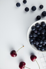 Close-up of cherries and blueberries on a wooden Board. Fresh berries