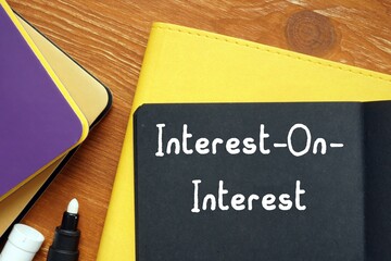 Financial concept about Interest-On-Interest with phrase on the sheet.