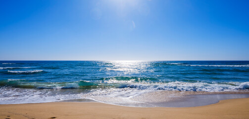 Calm sea with cloudy sky at sunset