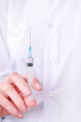 hands of a nurse holding a rifle with liquid