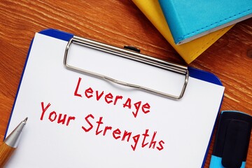 Motivation concept about Leverage Your Strengths with sign on the page.