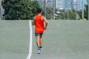 Fototapeta premium runner on the street be running for exercise on city road; sport, people, exercising and lifestyle concept