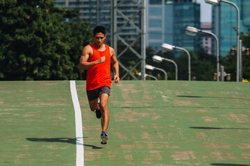 Obraz premium runner on the street be running for exercise on city road; sport, people, exercising and lifestyle concept