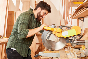Schreiner trainee works on the chop saw