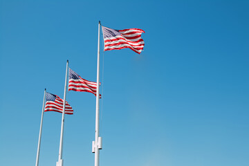 Three USA flags in a row