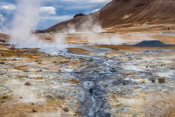 Hverir geothermal area with boiling mudpools and steaming fumaroles in Iceland