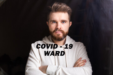 Fototapeta premium Hospital quarantine or isolation of patient standing alone in room with hopeful for treatment of Coronavirus COVID-19 Pandemic, Outbreak Efforts prevent virus spreading hazard controls concept.