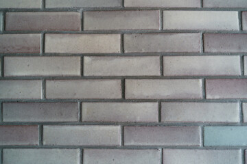 Grey brick tiled wall texture background.