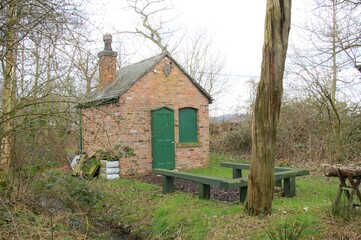 Fototapeta na wymiar An old gamekeeper's hut at the Duck Decoy Pond at Hale, Cheshire, England.
