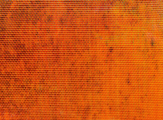 Pattern of abstract red-orange old material.