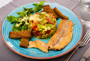 Trout fillets with guacamole salad