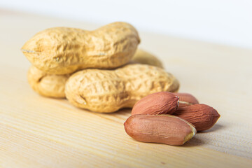 Peanuts on a wooden surface