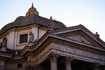 Fototapeta na wymiar Facade of the Basilica Santa Maria in Montesanto on piazza del Popolo in Rome