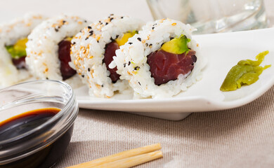 Delicious uramaki sushi from raw tuna fish and fresh avocado
