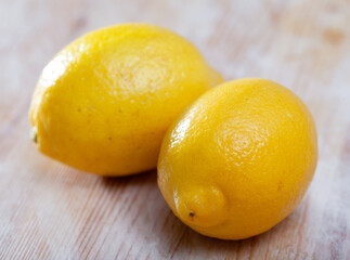 Whole lemon on wooden table