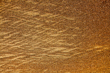 The texture of the sand of the sea , golden sandy beach.
