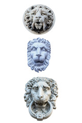 three plaster sculptures of lion heads to decorate the facade of the building isolated on a white background
