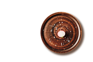 red radish on a plate on a light background