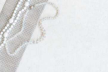 white beads on the grey surface of the table