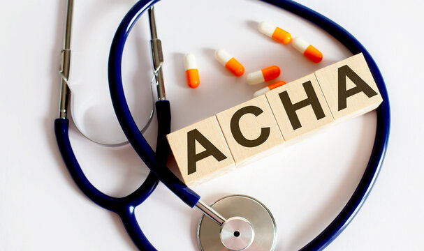 Beautiful stethoscope with pills .Wooden blocks ACHA