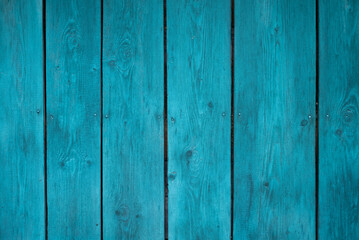 The wall of the house is made of old wood. Wooden details in the form of a lines. Background and texture of old painted wood.