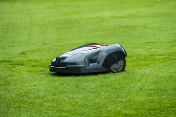 Robotic lawn mower on grass field - 359407887