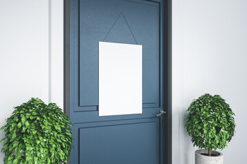 Blue door in empty room with blank poster.