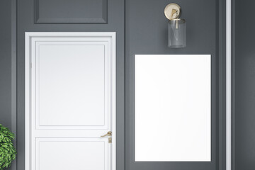 White door in room with blank banner on gray wall.