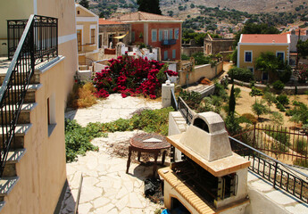 Obraz na płótnie Canvas Traditional house and courtyard in Symi town, Symi island, Greece
