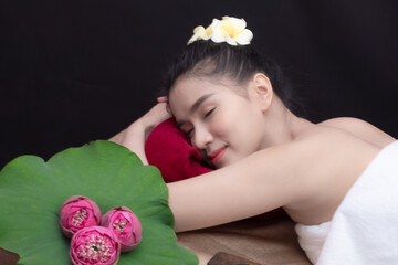 Beauty Woman Relaxing and Lying Down in spa salon.