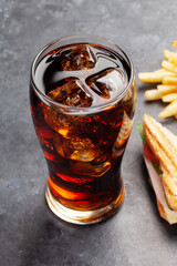 Glass of cola, club sandwich and potato fries chips