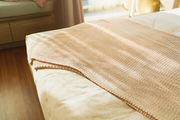 Fototapeta na wymiar close up soft bed blanket and fur carpet rug near window bedroom