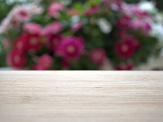 Empty wood table top on blur flowers in garden background ,nature abstract blurred, display product, balnk table	
