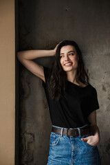 Photo of beautiful young brunette woman smiling and looking aside