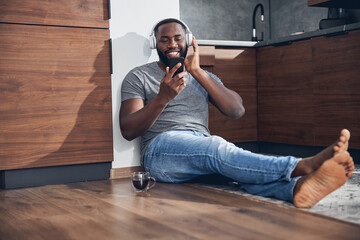 Kind international male person reading income message