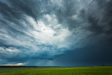 Fototapeta na wymiar Supercell storm clouds with intense tropic rain