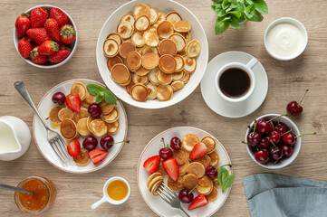 mini pancakes with fresh berries, breakfast concept