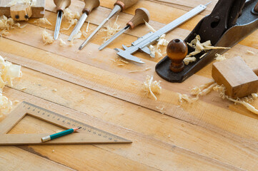 Carpentry tools on wooden table background with copy space