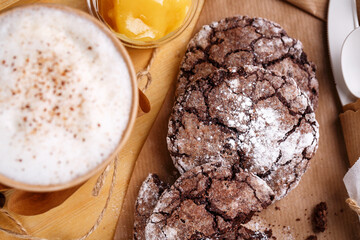 Chocolate chip cookies on a brown table. Place for text. Blurred background.