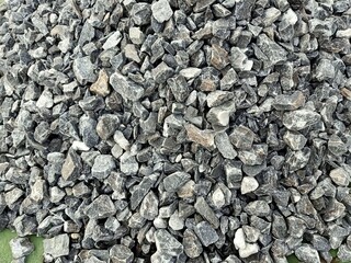 White crushed stones texture background. Gray rubble construction rock pebble pattern. top view.