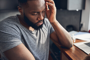 Obraz premium Close up of sad male that sitting at the table