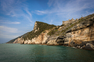 Doria Castle (1164-XIX century) of Porto Venere or Portovenere town (UNESCO world heritage site) on the rocky coastline along the Mediterranean Sea. La Spezia, Liguria, Italy, Europe