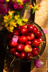
Still life composition of flowers, cherries or cherries, as well as mulberry