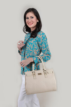elegant ladies carrying women's handbags and shopping bags