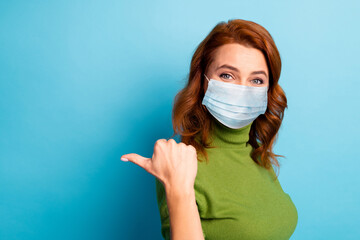 Close-up portrait of her she attractive healthy girl wearing safety gauze mask showing copy space mers cov influenza symptom syndrome isolated bright vivid shine vibrant green blue color background