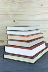 Stack of books on table at library.
