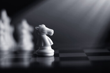 White chess knight on chess board © fotokitas