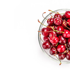 Obraz na płótnie Canvas Bowl of fresh red cherries on white. Cherry berries with copy space. Food, fruit background